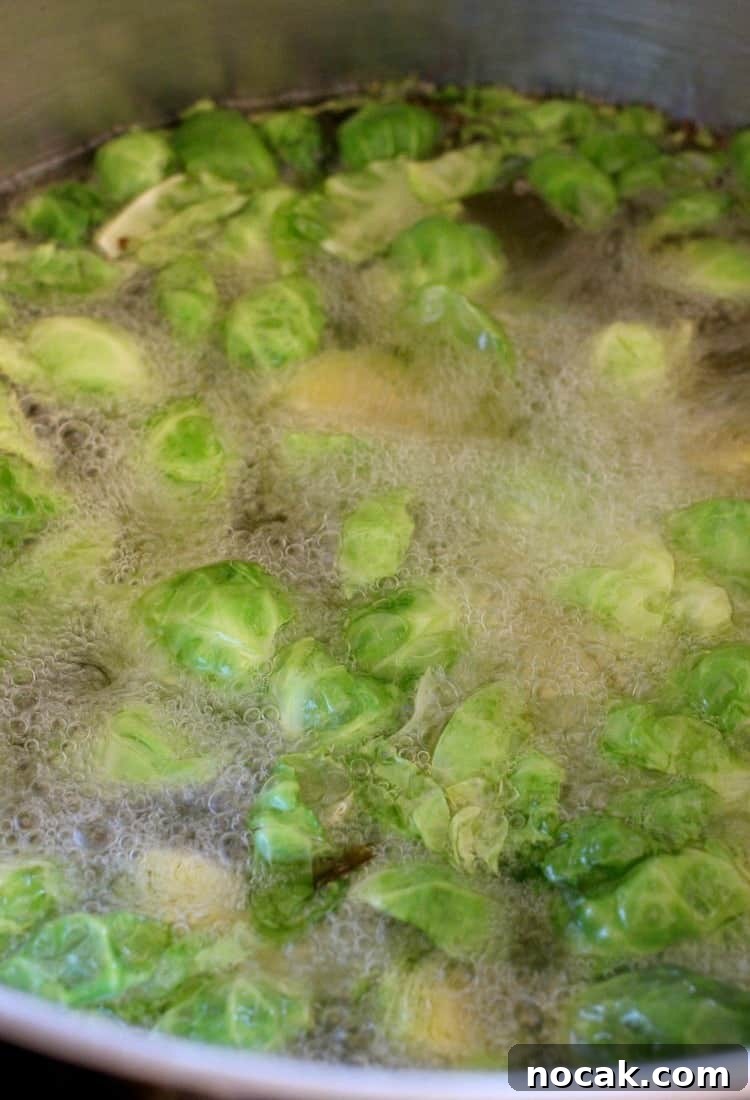 Whiskey Glazed Brussels Sprouts is the side dish you've been looking for! Fried brussels sprouts tossed in our famous whiskey glaze! Fried Whiskey Glazed Brussels Sprouts fry for a few minutes, then tossed in that awesome glaze!