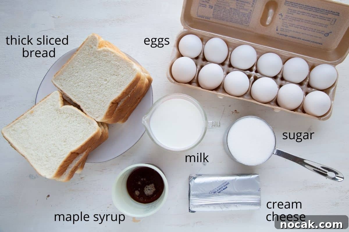 Baked Stuffed French Toast Casserole with Creamy Filling 4 stuffed french toast ingredients on a white table.