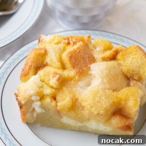 Baked Stuffed French Toast Casserole with Creamy Filling 9 slice of stuffed french toast on a white china plate.