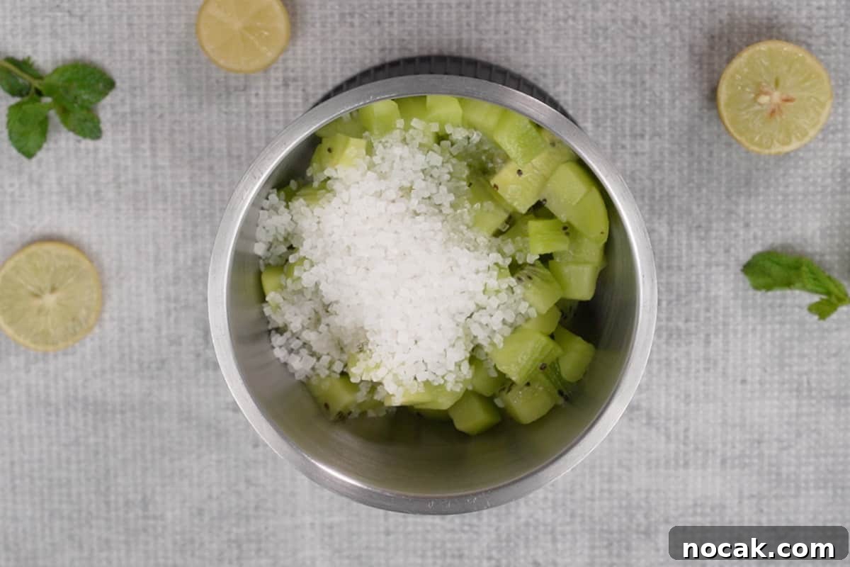 Refreshing Kiwi Soda Recipe: Sparkling Homemade Drink 3 Kiwi, sugar and lime juice added to a blender.