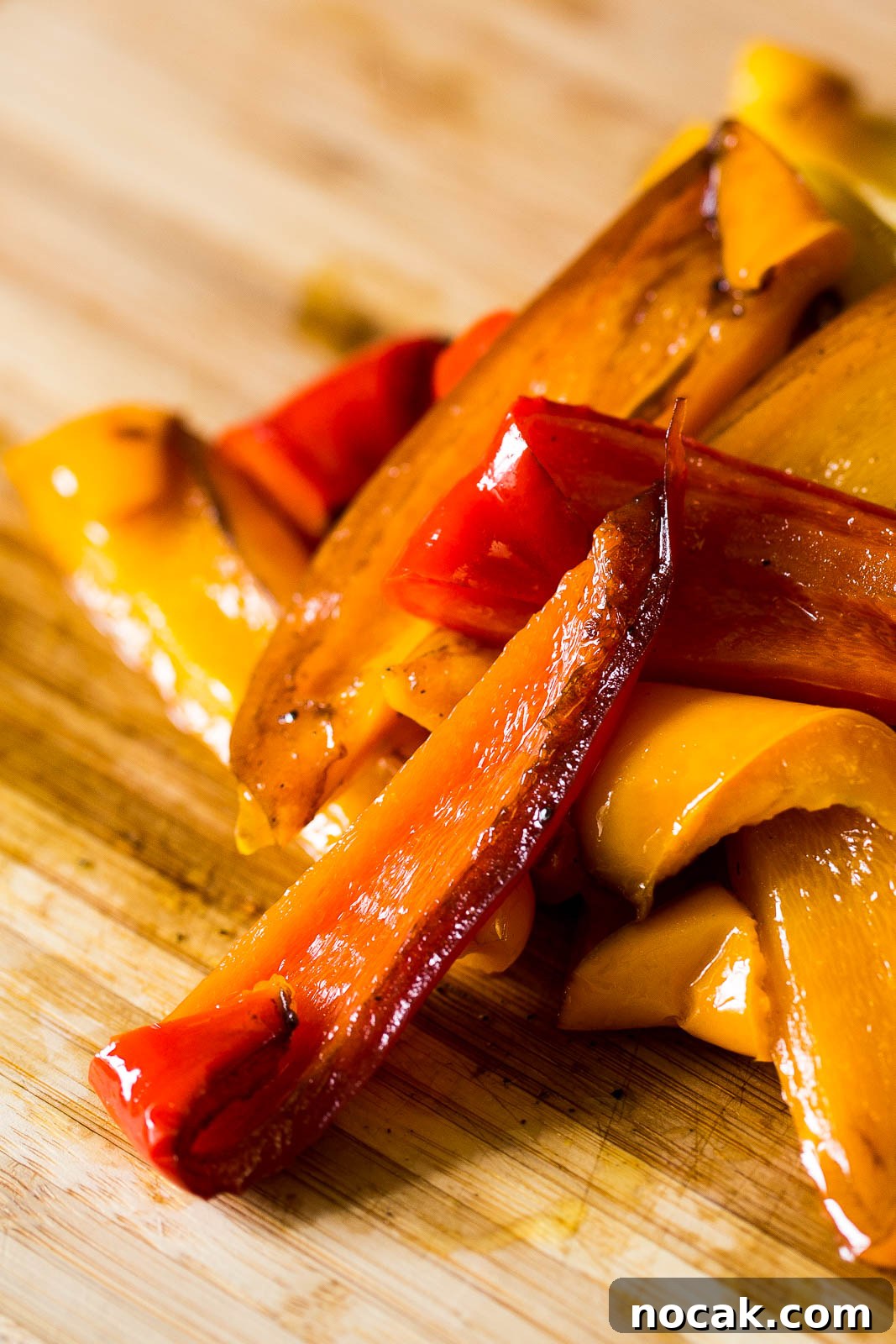 Balsamic roasted peppers are a mediterranean treat made with red, orange, green or yellow peppers, gently braised in the oven with garlic, balsamic vinegar and extra virgin olive oil until they become soft, sweet, richly flavoured slithers of pepper. Perfect for a salad, a picnic or to be served alongside cheese, charcuterie and olives as antipasti. Alternatively make ahead and store them in the fridge until you need them.