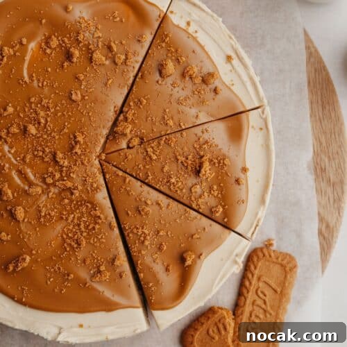 A biscoff cheesecake with 3 slices cut.