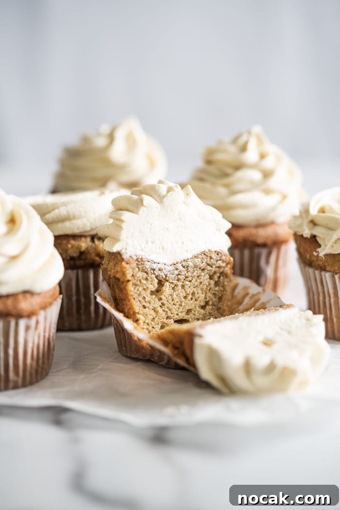 Keto Vanilla Cupcakes: Fluffy Gluten-Free Paleo Recipe 2 Keto vanilla cupcake with buttercream frosting over marble surface