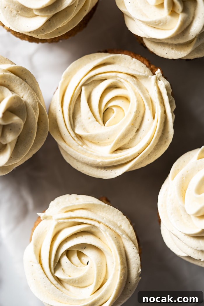 Keto Vanilla Cupcakes: Fluffy Gluten-Free Paleo Recipe 5 Closeup Keto vanilla buttercream frosting piped into rosettes