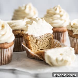Keto Vanilla Cupcakes: Fluffy Gluten-Free Paleo Recipe 7 Keto vanilla cupcake with buttercream frosting over marble surface