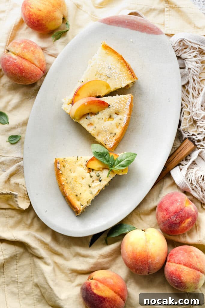 Basil Peach Ricotta Cake Recipe — Fresh Summer Dessert 3 Three slices of peach cake on an oval plate next two yellow peaches.