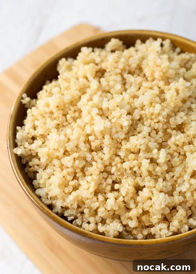 Instant Pot Quinoa: Perfect Fluffy Quinoa in 12 Minutes 4 Quinoa in a brown bowl on wooden board