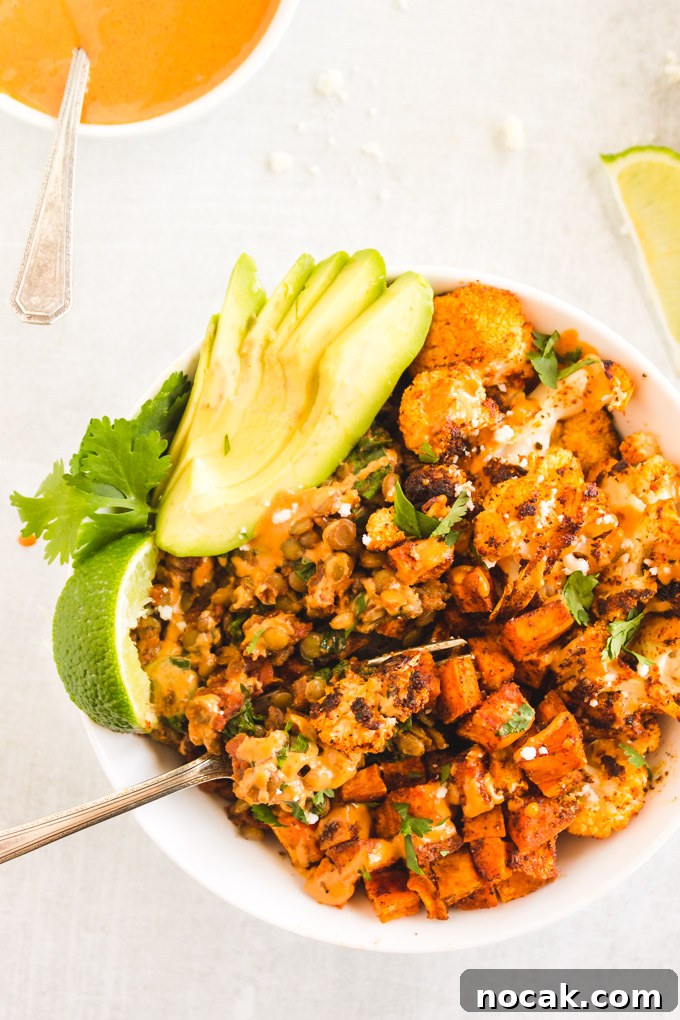 Chipotle Lentil Sweet Potato Buddha Bowl - Packed with healthy ingredients that are bursting with flavor, lentil sweet potato buddha bowl is the perfect vegan entree any day of the week.  Only takes 40 minutes to make! #veganmeal #buddhabowl #glutenfreerecipe #lentils #weeknightdinner #dairyfree | RobustRecipes.com