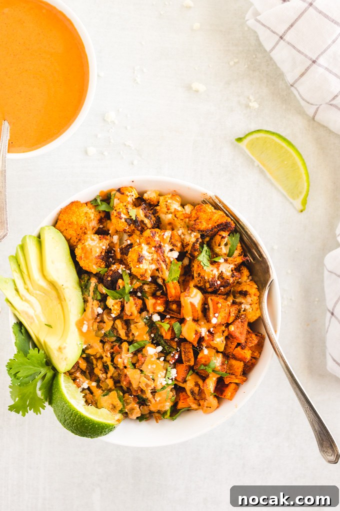 Chipotle Lentil Sweet Potato Buddha Bowl - Packed with healthy ingredients that are bursting with flavor, lentil sweet potato buddha bowl is the perfect vegan entree any day of the week.  Only takes 40 minutes to make! #veganmeal #buddhabowl #glutenfreerecipe #lentils #weeknightdinner #dairyfree | RobustRecipes.com