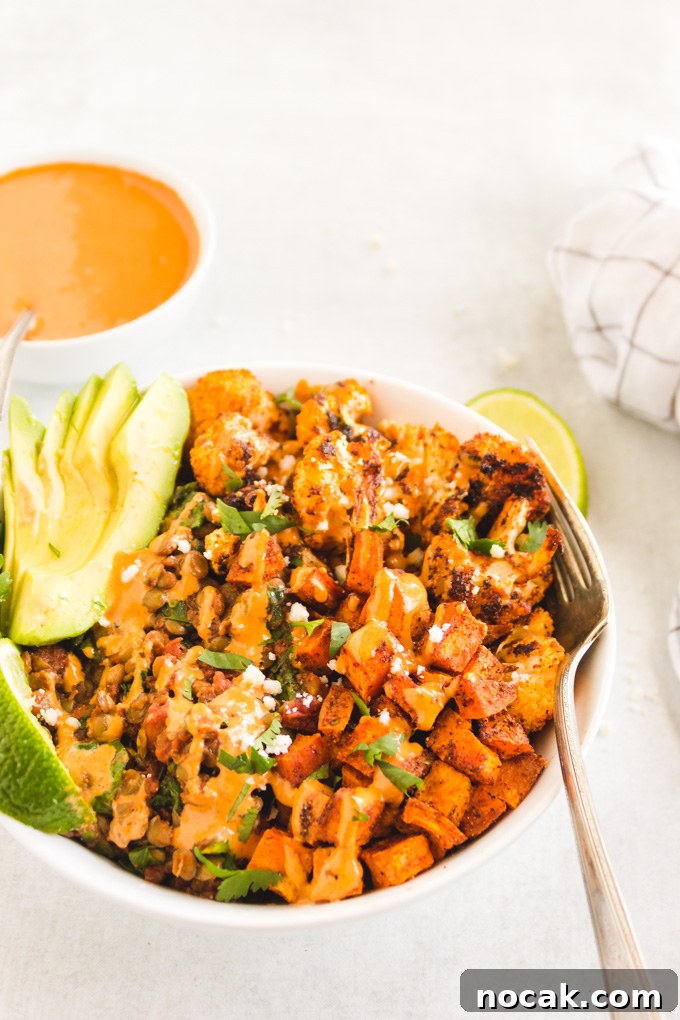 Chipotle Lentil Sweet Potato Buddha Bowl - Packed with healthy ingredients that are bursting with flavor, lentil sweet potato buddha bowl is the perfect vegan entree any day of the week.  Only takes 40 minutes to make! #veganmeal #buddhabowl #glutenfreerecipe #lentils #weeknightdinner #dairyfree | RobustRecipes.com