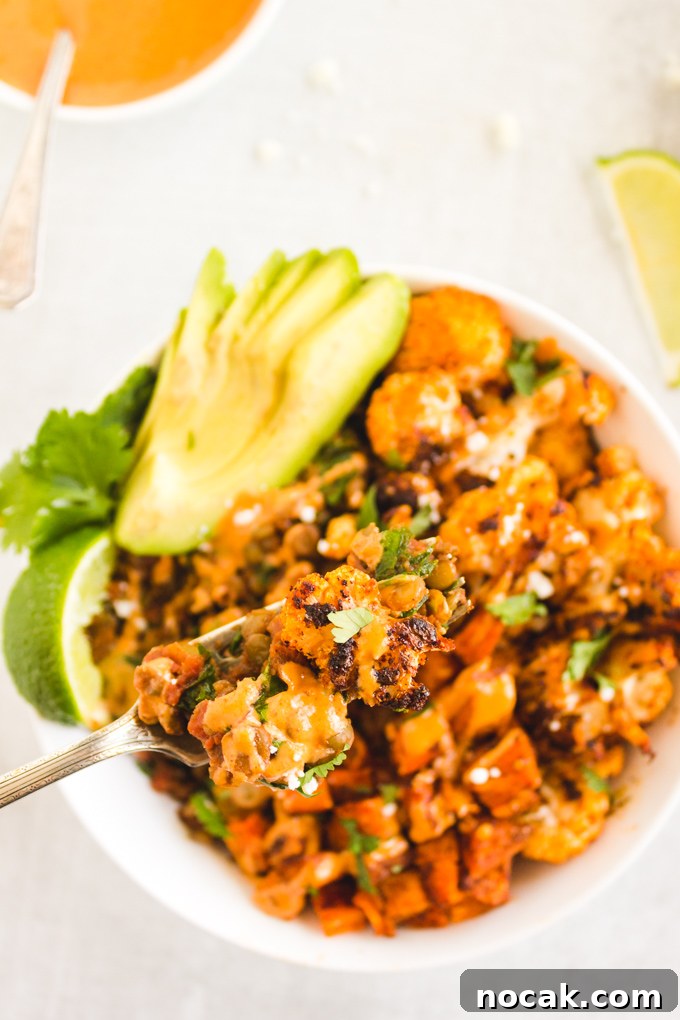 Chipotle Lentil Sweet Potato Buddha Bowl - Packed with healthy ingredients that are bursting with flavor, lentil sweet potato buddha bowl is the perfect vegan entree any day of the week.  Only takes 40 minutes to make! #veganmeal #buddhabowl #glutenfreerecipe #lentils #weeknightdinner #dairyfree | RobustRecipes.com