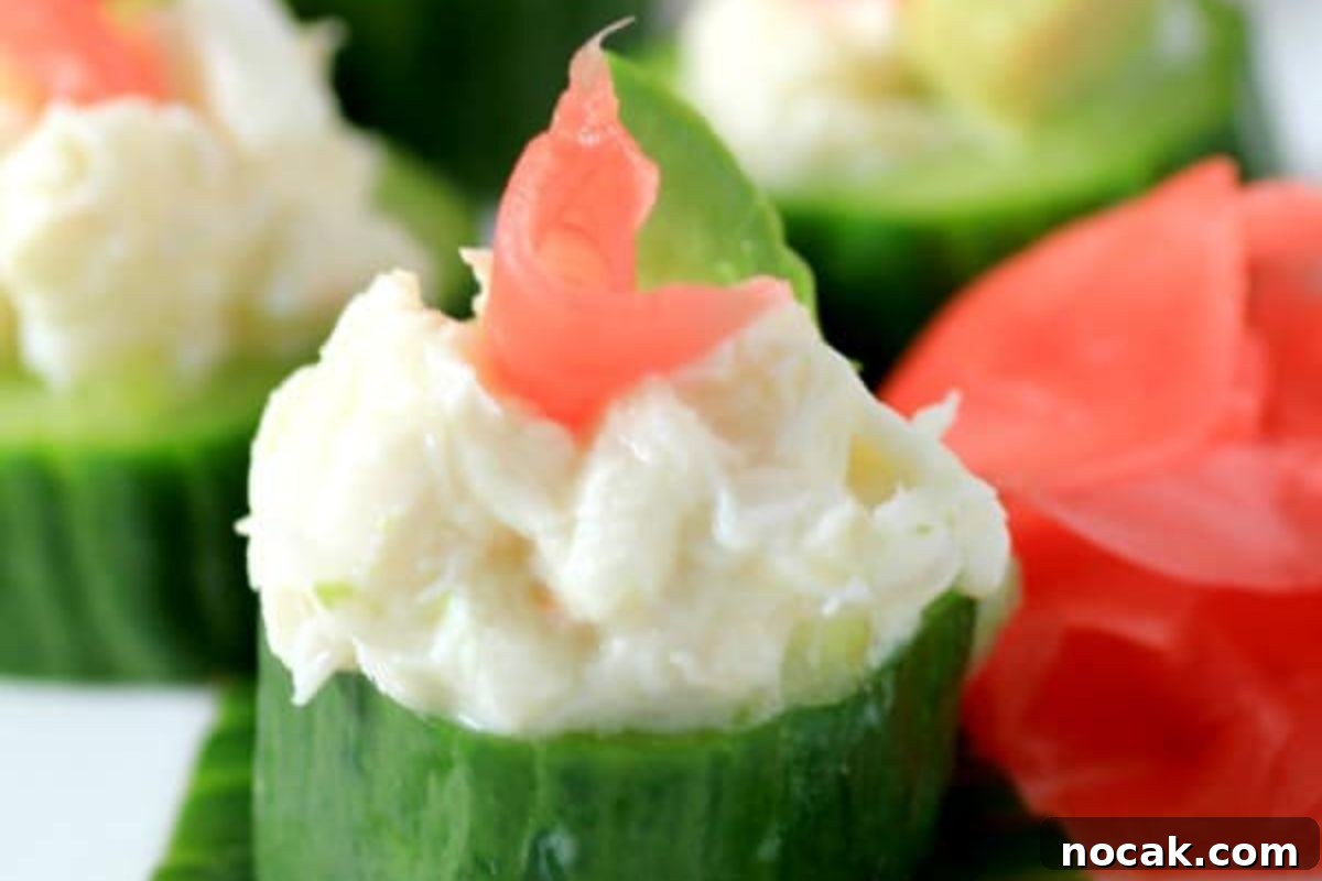 35 Easter Appetizers to Kick Off Your Holiday Feast 17 Sliced cucumber cups filled with cream cheese garnished with pink accents, perfect as an Easter appetizer.