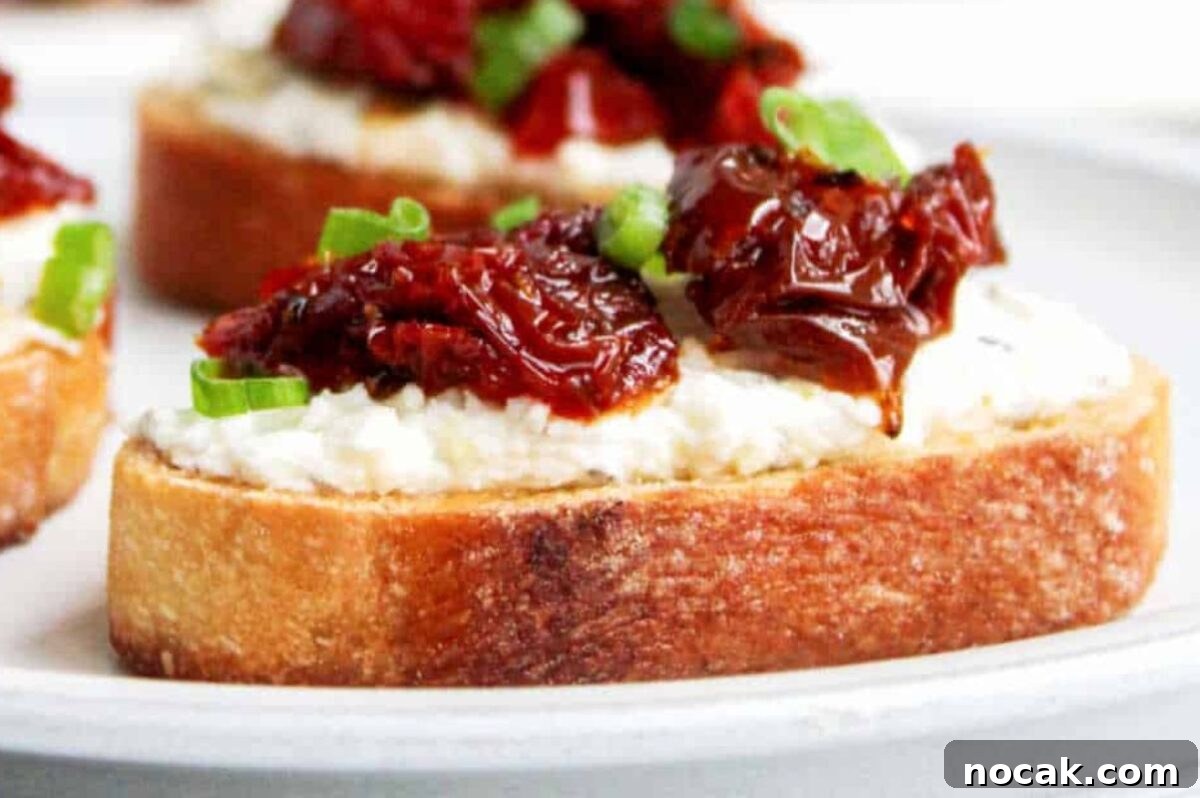 35 Easter Appetizers to Kick Off Your Holiday Feast 19 Easter appetizer: Crostini topped with cheese and sundried tomatoes, garnished with chopped chives.