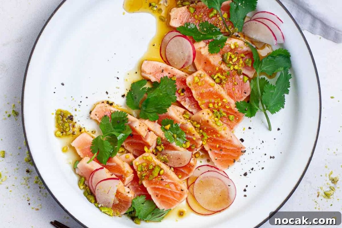 35 Easter Appetizers to Kick Off Your Holiday Feast 29 An Easter appetizer: a plate of salmon carpaccio garnished with radish slices, herbs, and a drizzle of sauce.
