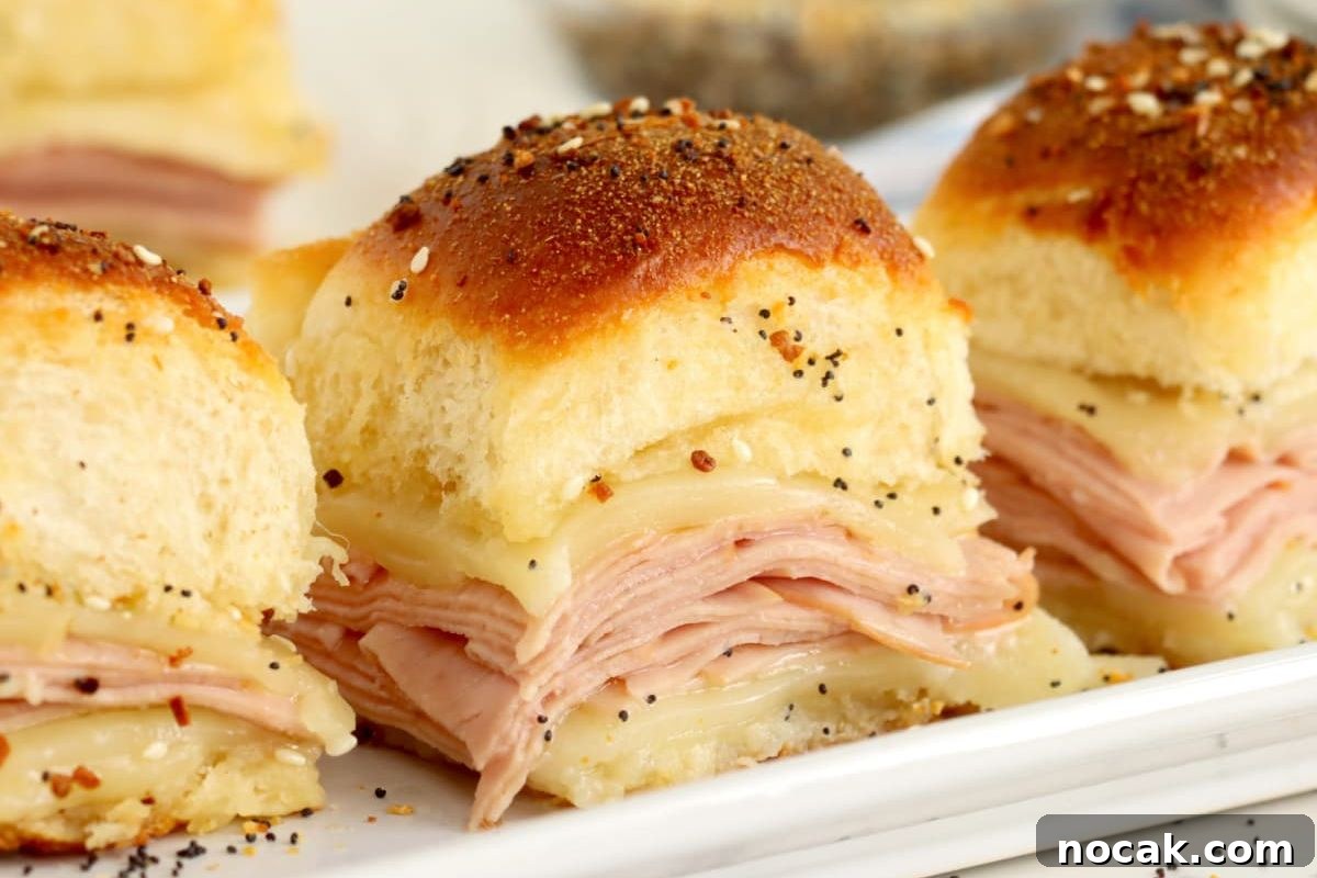 35 Easter Appetizers to Kick Off Your Holiday Feast 36 Freshly baked sliders with ham and melted cheese, topped with sesame seeds, perfect for an Easter appetizer.