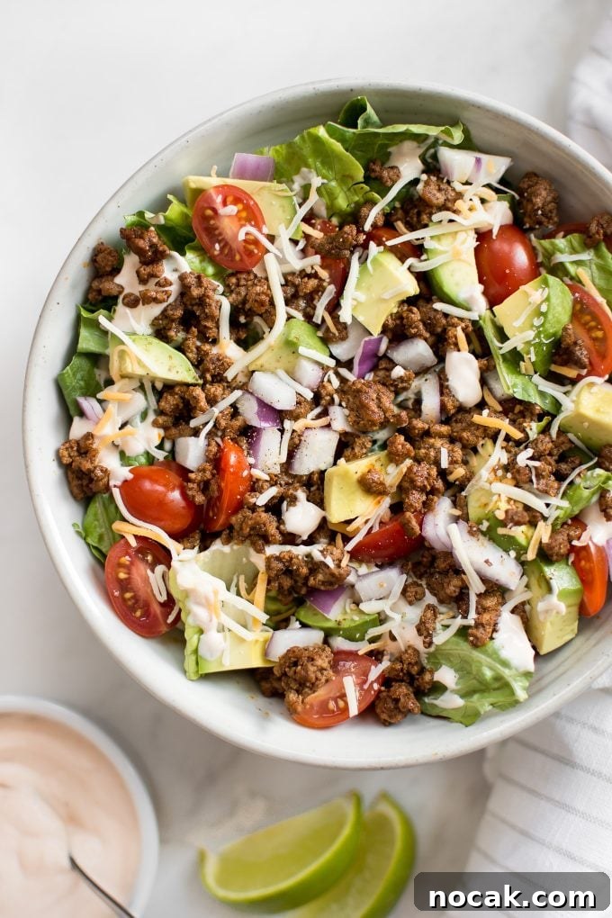 Low-Carb Chicken Taco Salad with Creamy Avocado Dressing 3 low-carb southwest beef taco salad with avocado in a bowl