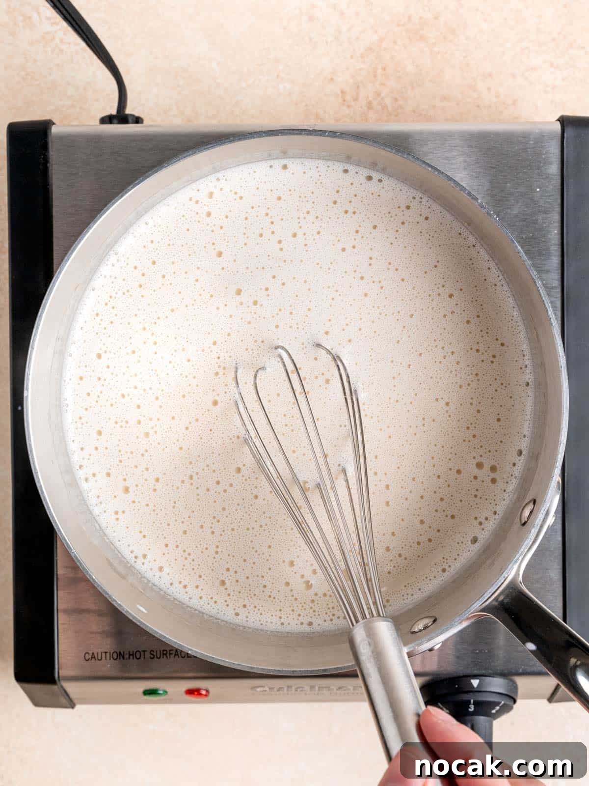 Chocolate Malted Crunch Ice Cream Recipe: Creamy Malted Chocolate with Crispy Crunch 5 Whisking milk, heavy cream, malt powder, vanilla extract and salt in a pot.