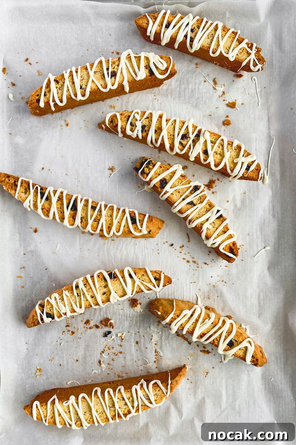 a tray with pieces of cherry almond biscotti on it.