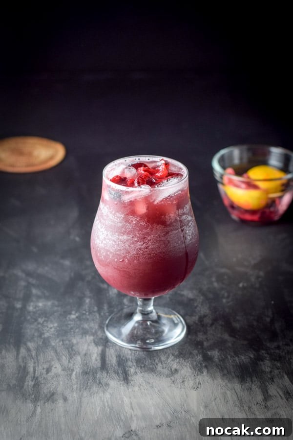 Top 5 Cocktail Recipes from 2017: Classic Drinks to Try 3 fruit added red wine sangria with a small glass bowl of it in the background