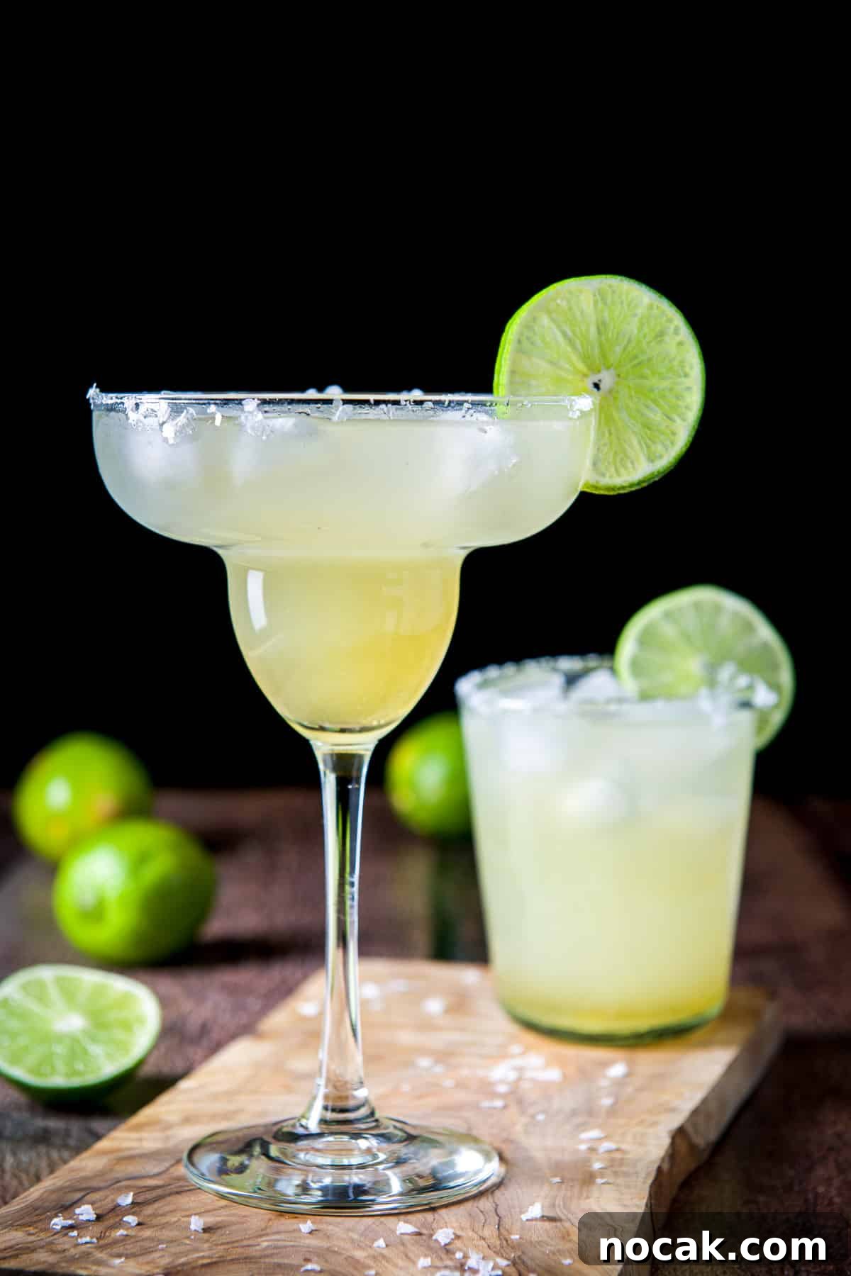 Top 5 Cocktail Recipes from 2017: Classic Drinks to Try 6 Classic margarita glass in front of a short glass with salt and lime in the back