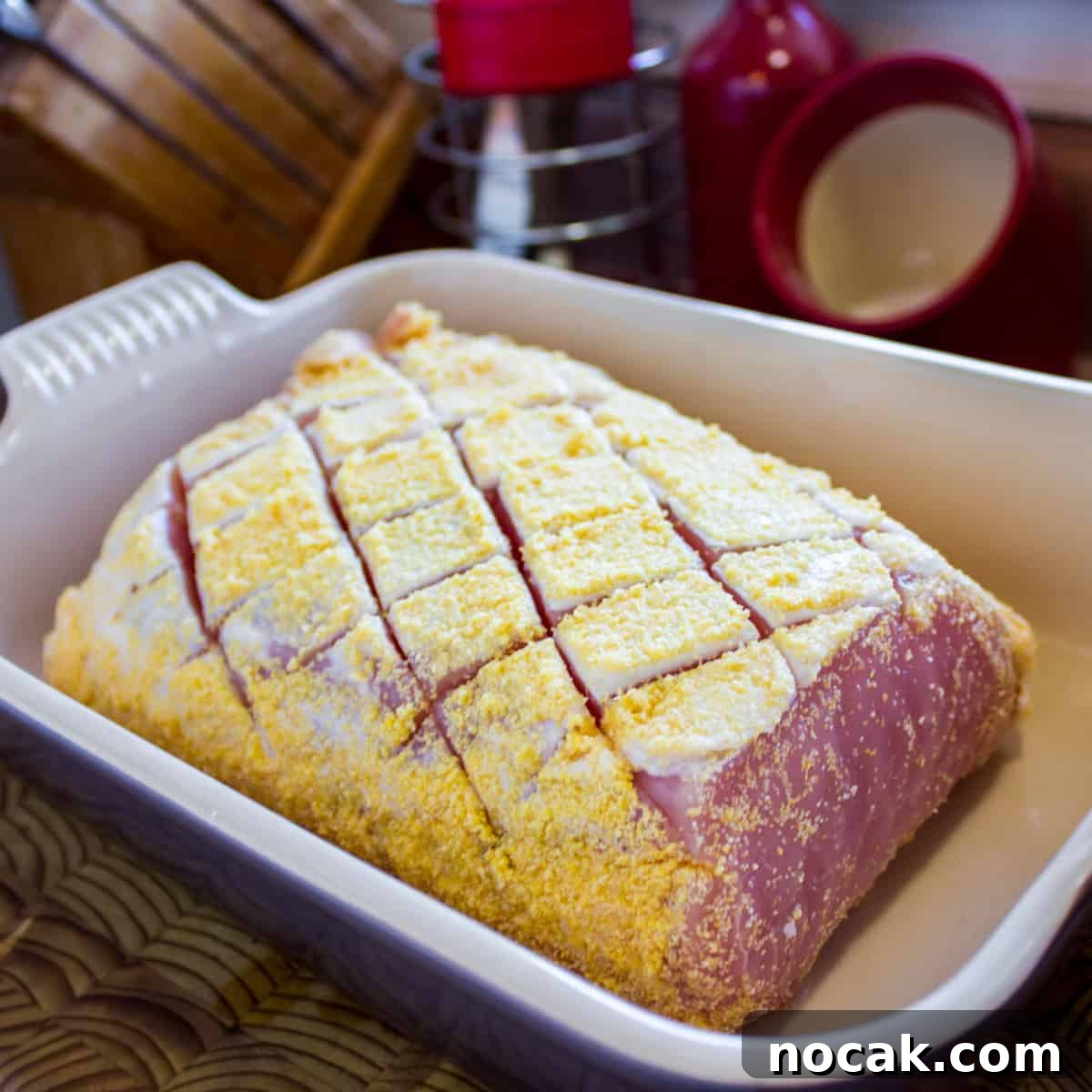 Uncooked pea meal bacon in a baking dish.