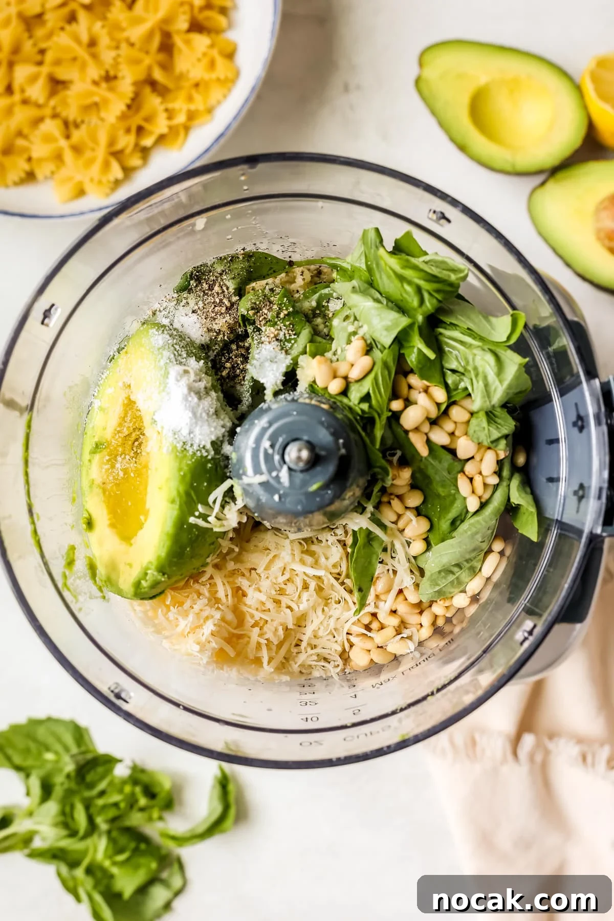 Creamy Avocado Pesto Pasta Recipe for Quick Weeknight Meals 4 ingredients to make pesto in a food processor.