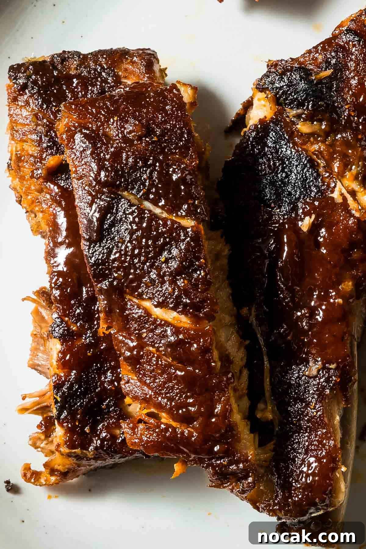 a closeup of st louis style oven-baked ribs just out of the oven