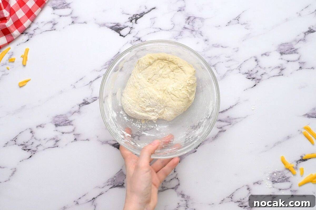 Copycat Taco Murphy's Pizza Pizza dough for taco pizza in bowl.