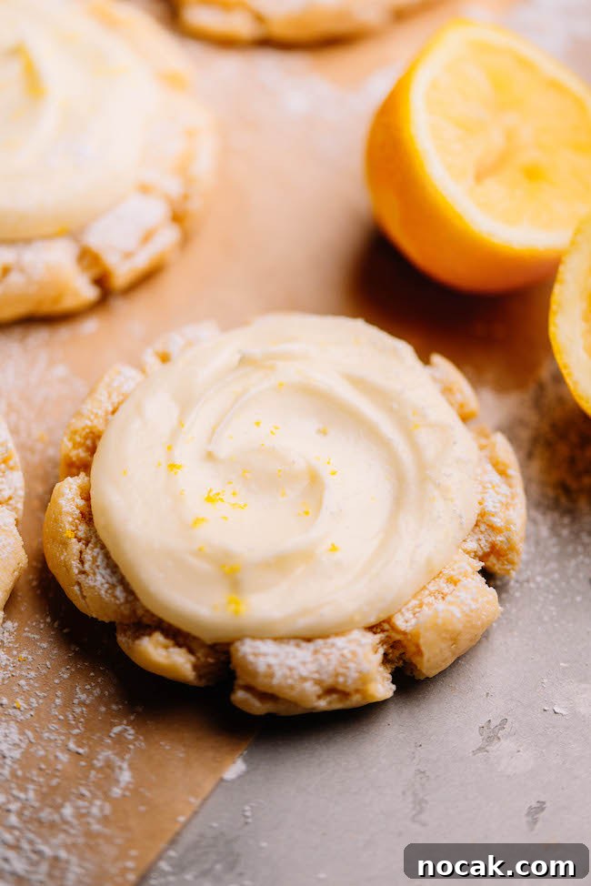 Soft Chewy Lemon Sugar Cookies Recipe for Perfect Texture 10 close up shot of lemon sugar cookie with crinkly edges and lemon cream cheese buttercream