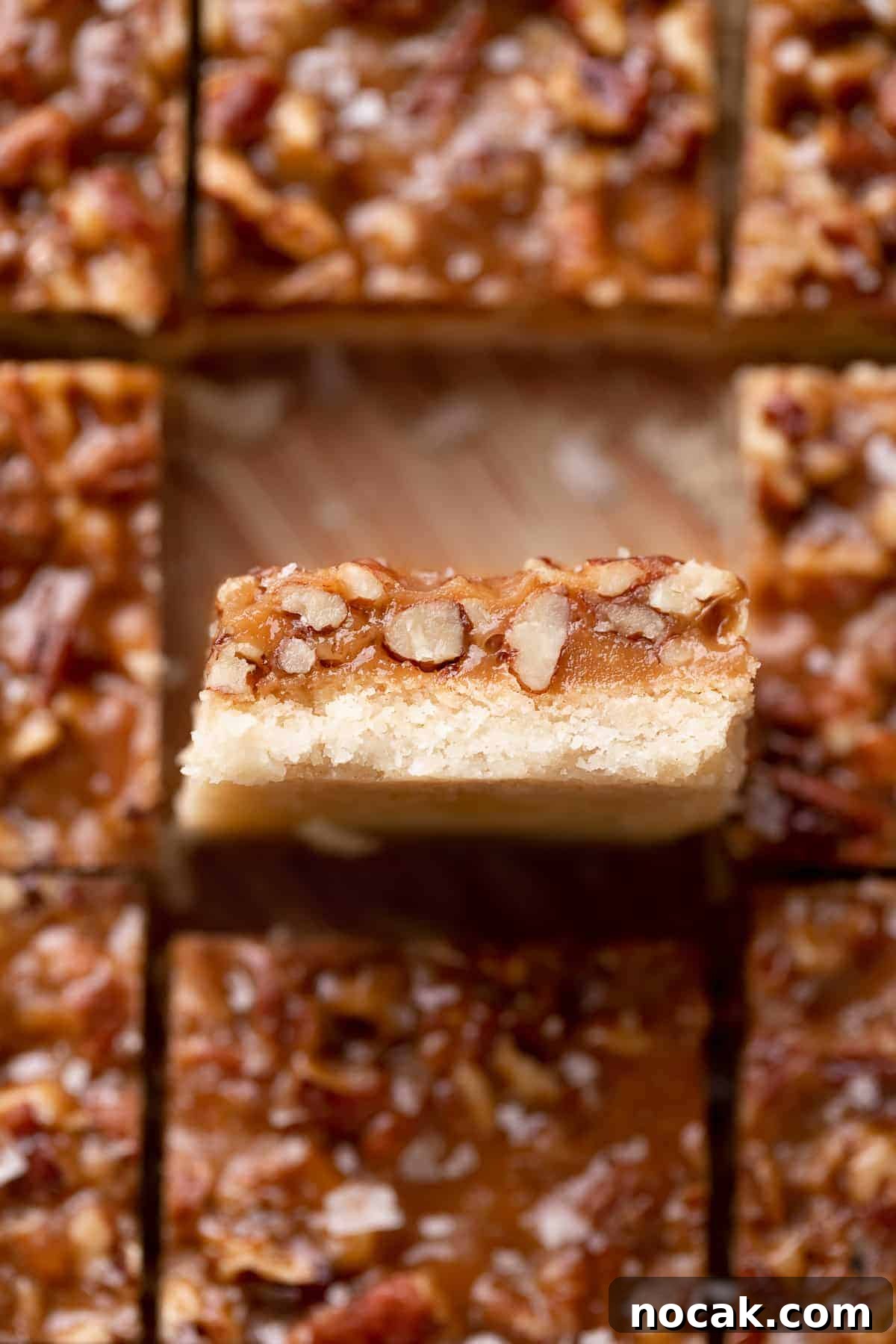 Salted Caramel Pecan Bars Recipe — Chewy Pecan Caramel Squares 10 pecan bar with shortbread crust cut into bars.