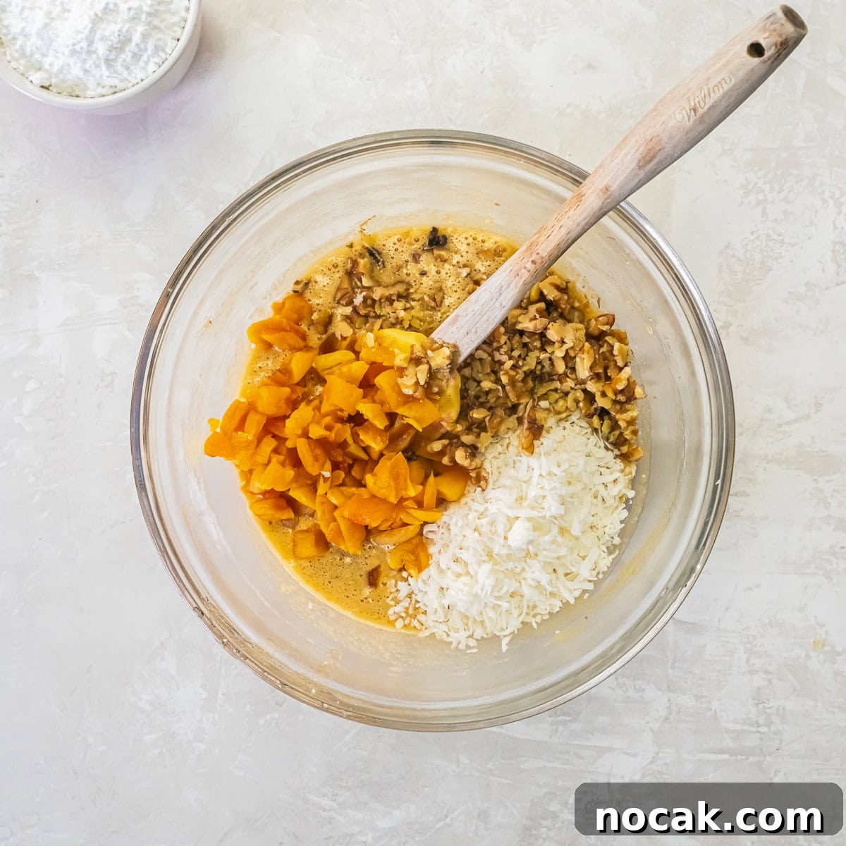 Chewy Apricot Bars with Oat Crust and Almond Glaze 11 Chopped dried apricots, walnuts, and flaked coconut added to the apricot bar batter.