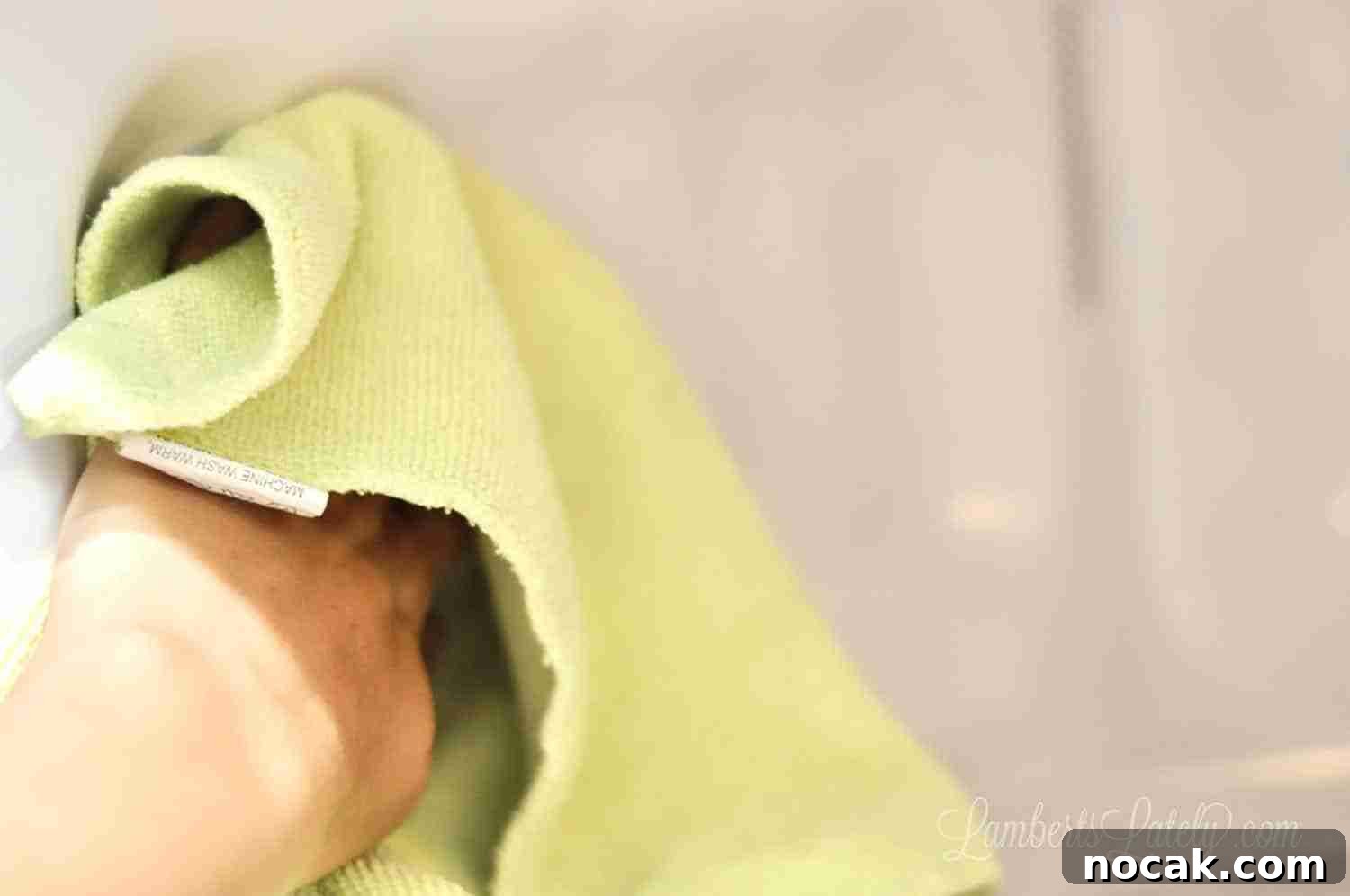 Clean Your Microwave Quickly Using Vinegar and Water 6 cleaning the inside walls of a microwave with microfiber cloth