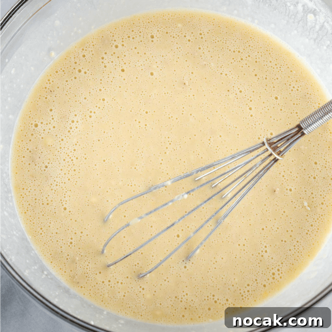 Homemade Apple Kolache Recipe with Video Tutorial 4 Mix of yeast, liquid and sugar start to bubble when activated with a whisk in a glass bowl