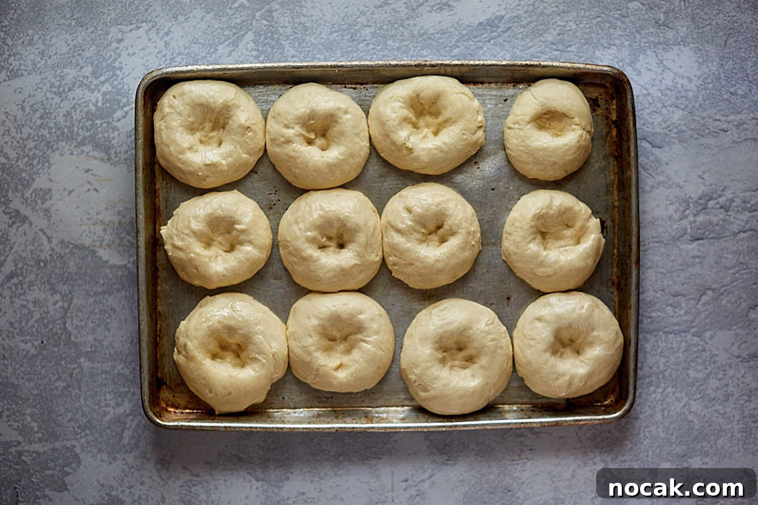 Homemade Apple Kolache Recipe with Video Tutorial 8 Top down view of rising kolache dough rolls with dented top.