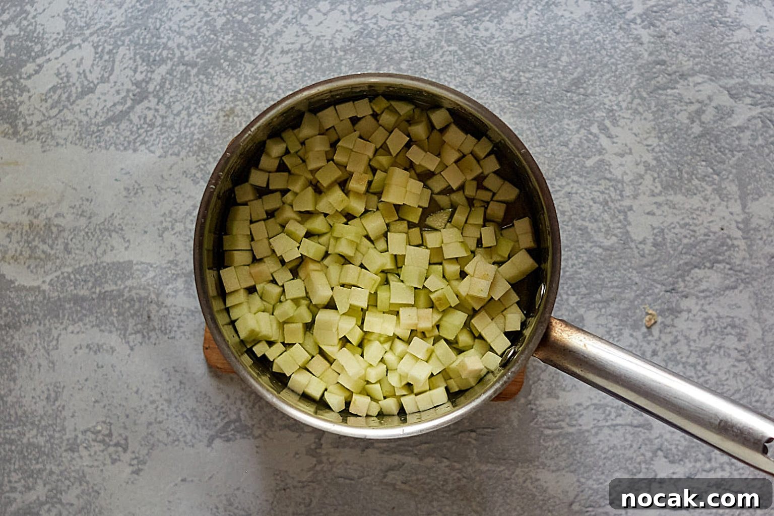 Homemade Apple Kolache Recipe with Video Tutorial 9 Diced apple in a saucepan