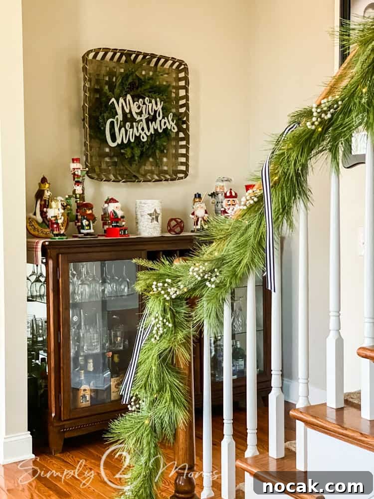 garland on staircase with gallery wall