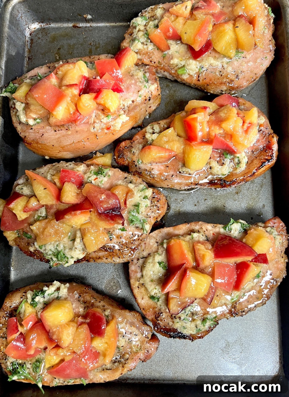 Cowboy butter pork chops with grilled peaches. Grilled pork chops with cowboy butter and grilled peaches.