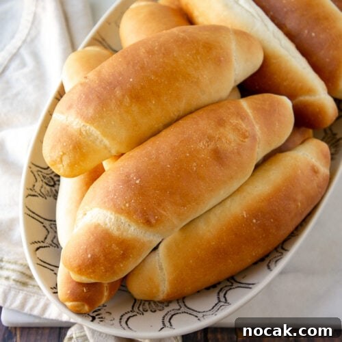 Soft Homemade Hot Dog Buns Recipe for Perfect Sandwiches 7 a bowl of homemade hot dog buns on a towel