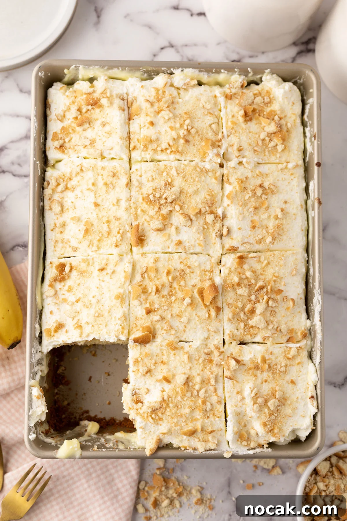 Creamy Banana Pudding Poke Cake Recipe for Dessert Fans 11 Baked Banana Pudding Poke Cake in baking pan.