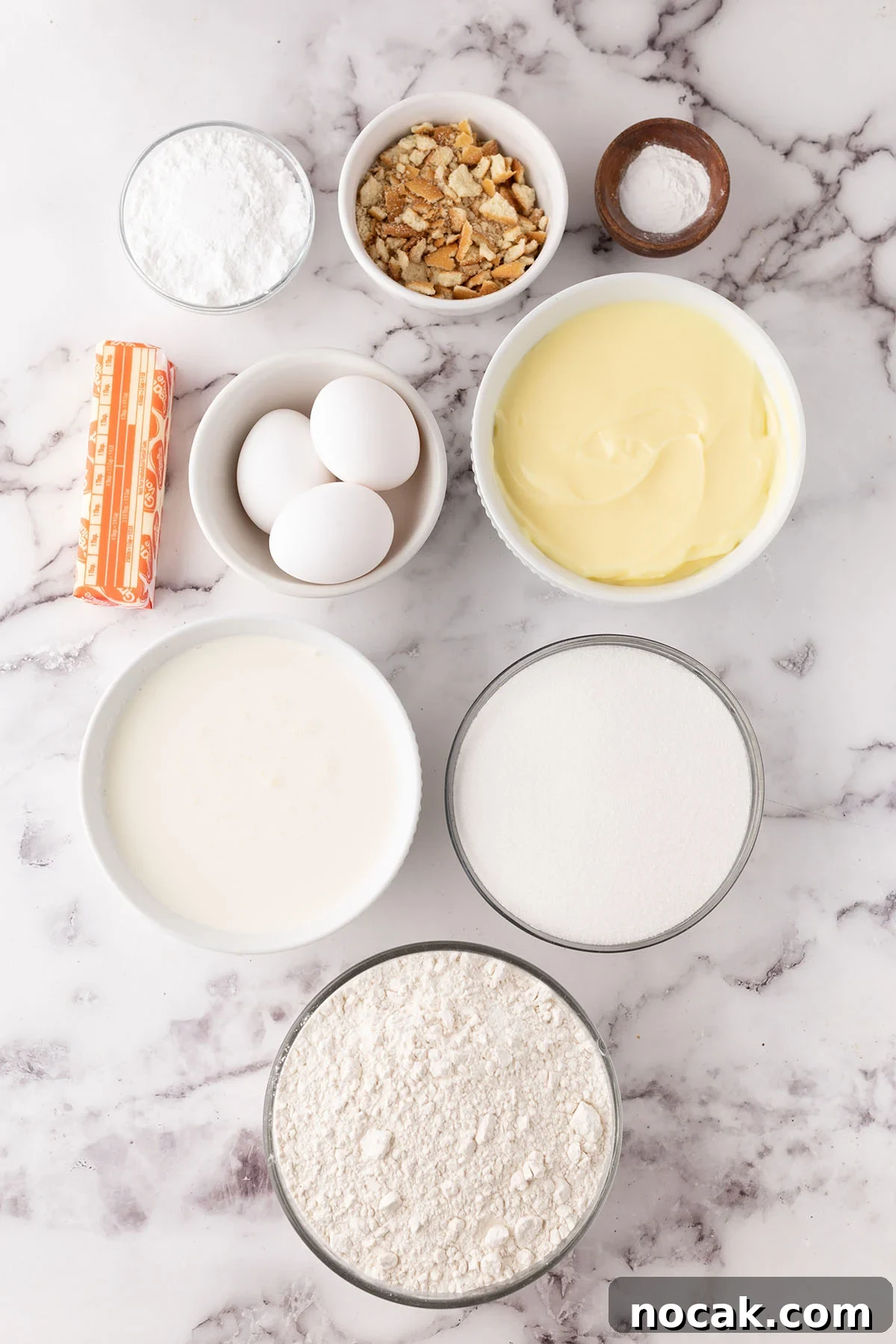 Creamy Banana Pudding Poke Cake Recipe for Dessert Fans 3 Ingredients to make banana pudding poke cake set out on the counter.