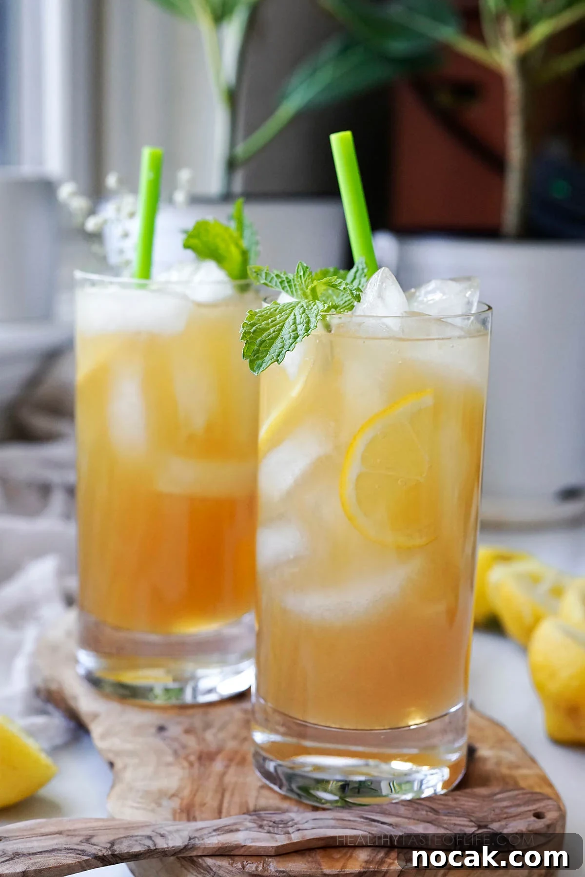 Refreshing Green Tea Lemonade with Fresh Lemon and Mint 4 Prepared homemade lemonade with green tea served in glasses with ice.