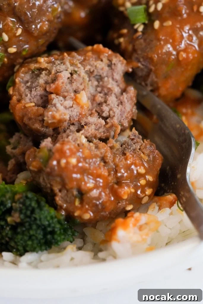 Spicy Firecracker Meatballs with Sweet Chili Glaze 13 closeup shot of a spicy firecracker meatball that has been cut in half.