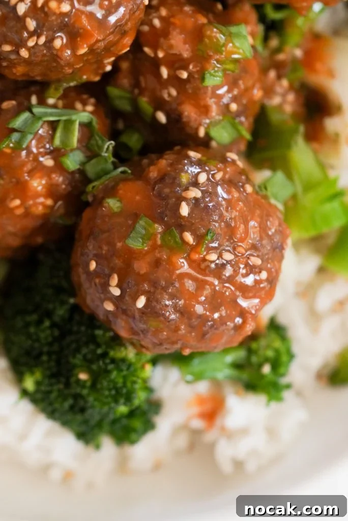 Spicy Firecracker Meatballs with Sweet Chili Glaze 15 overhead shot of a bowl of firecracker meatballs with rice and veggies.