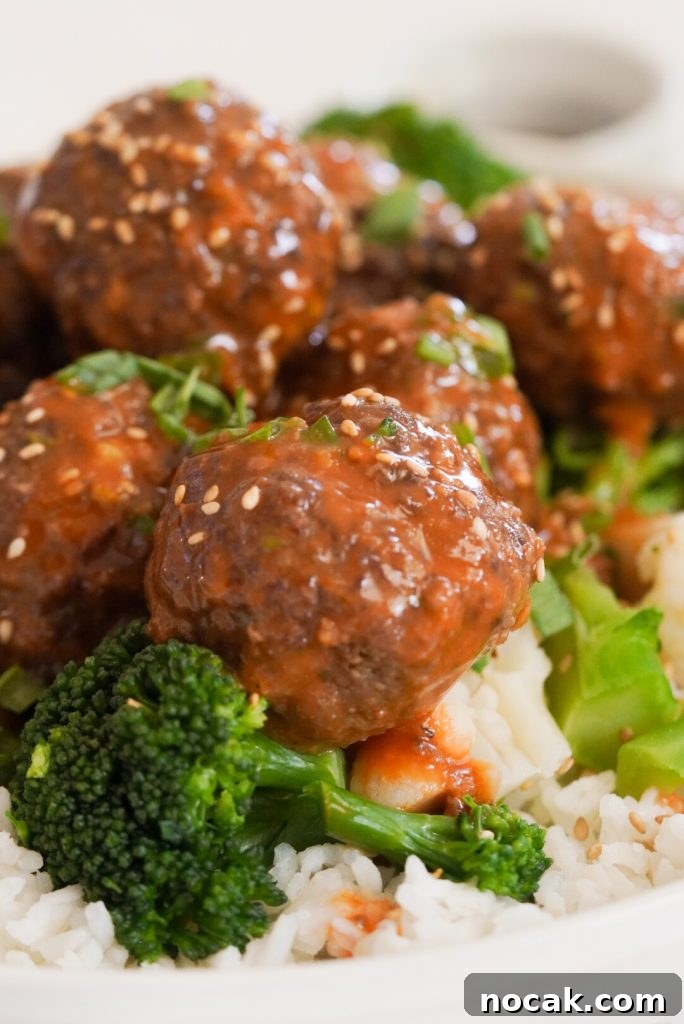 Spicy Firecracker Meatballs with Sweet Chili Glaze 3 beef meatballs with spicy firecracker sauce and broccoli.