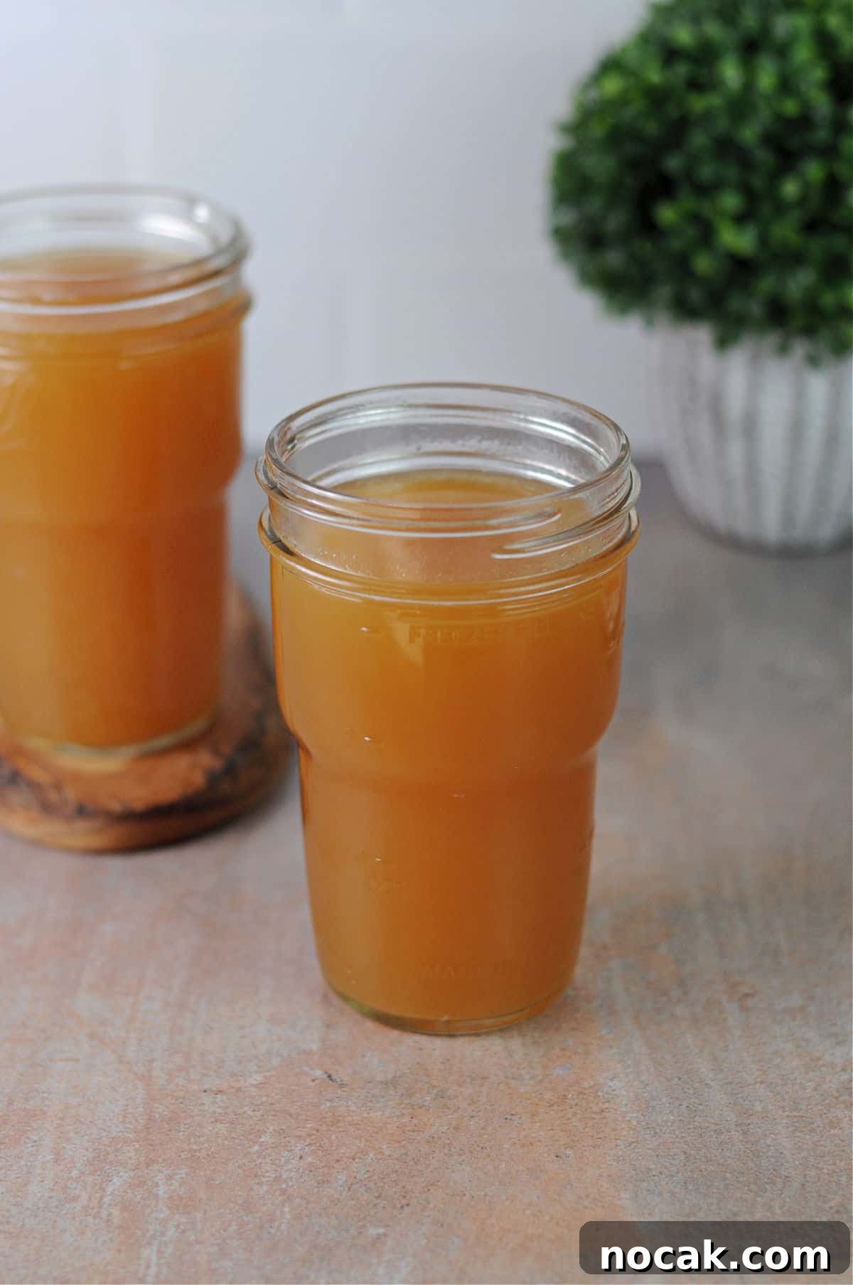 Mason jars of turkey bone broth made in the Instant Pot.