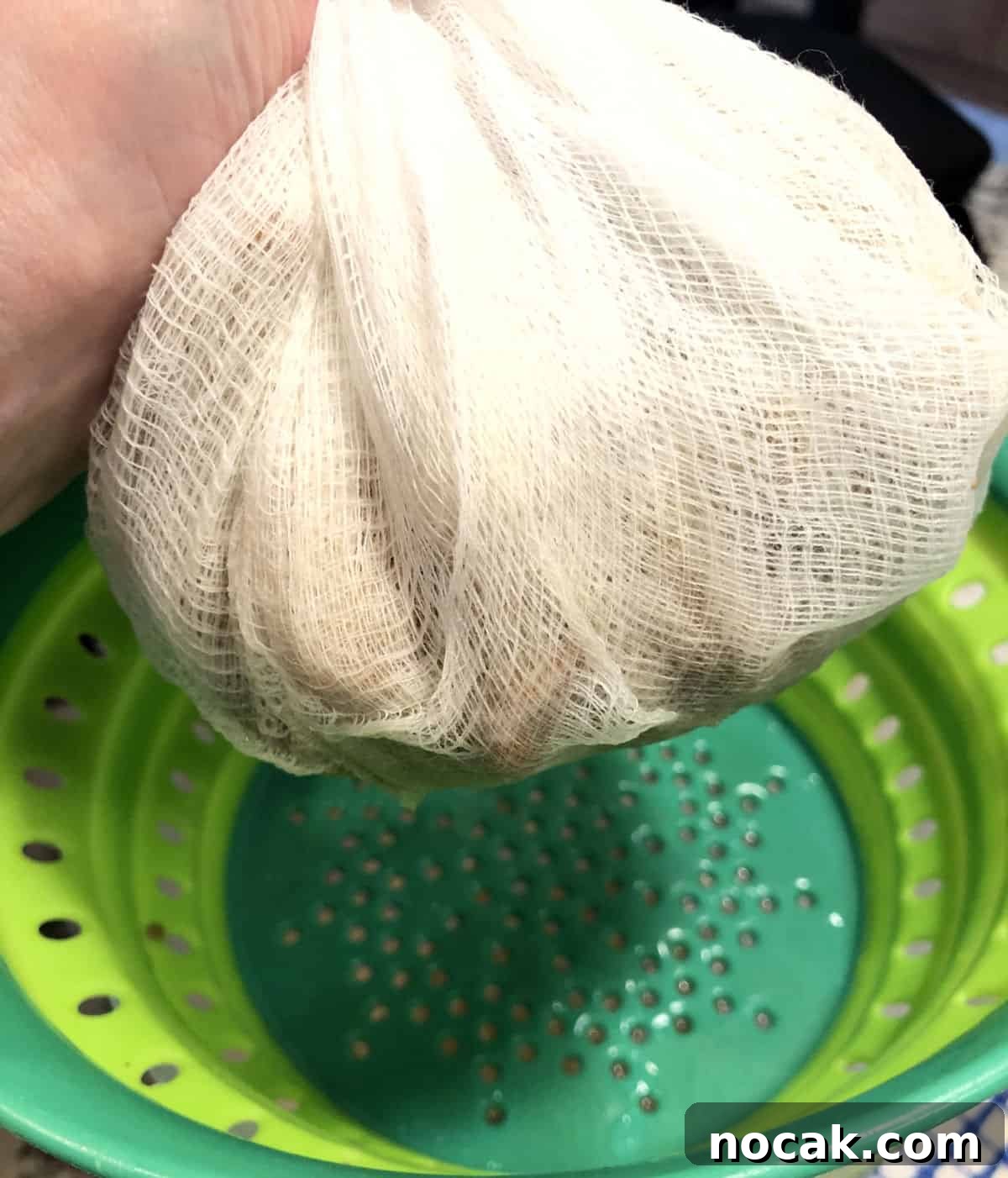 cheesecloth gathered to squeeze the solids