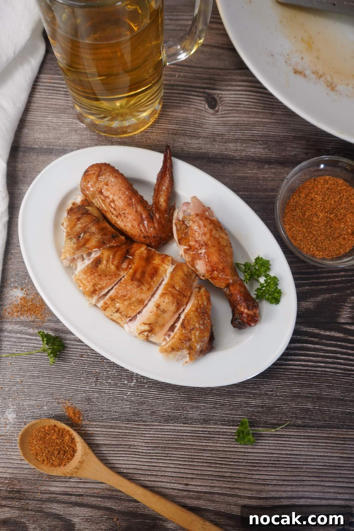 Juicy Smoked Whole Chicken Recipe for Tender, Flavorful Results 8 Smoked chicken on white plate