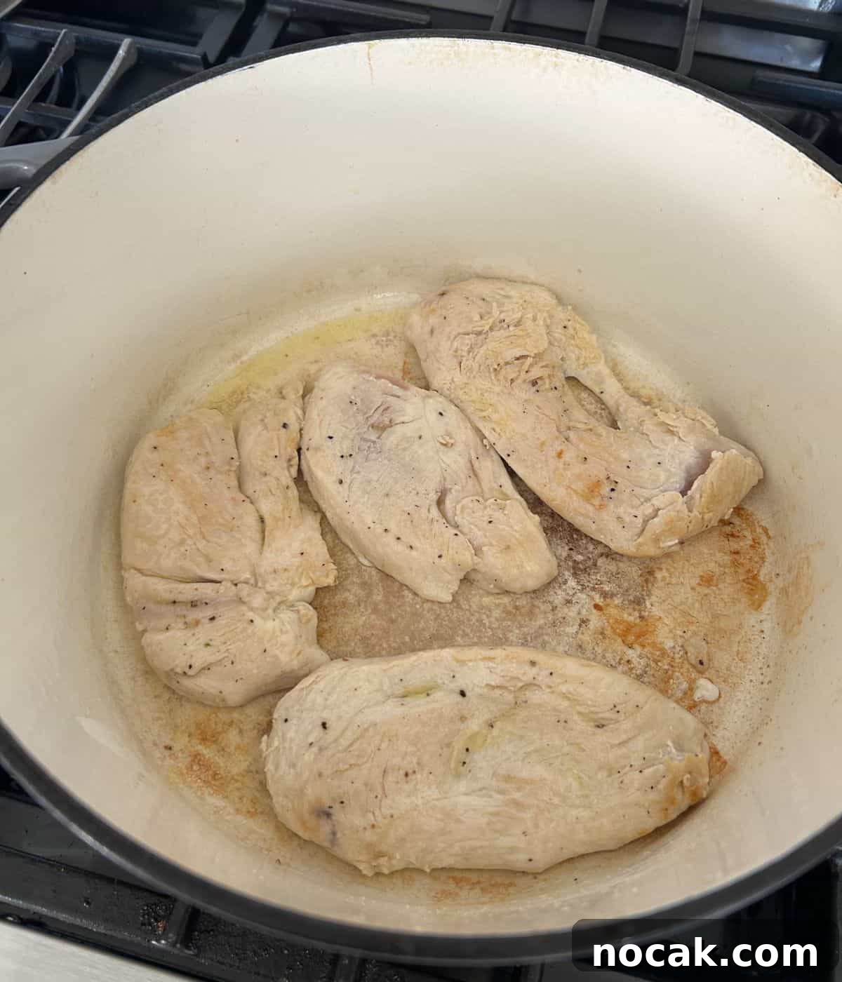 Creamy One-Pot Chicken and Orzo Bake: Comforting Weeknight Meal 6 Chicken cooking in dutch oven.
