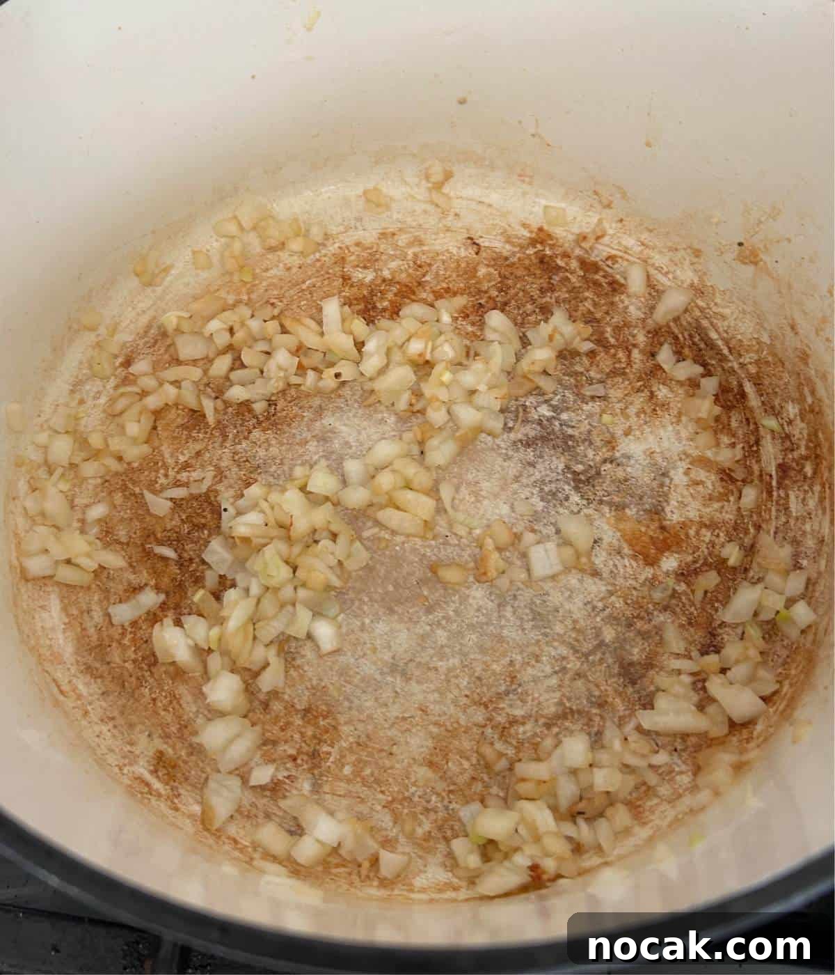 Creamy One-Pot Chicken and Orzo Bake: Comforting Weeknight Meal 7 Softened onions in pot.