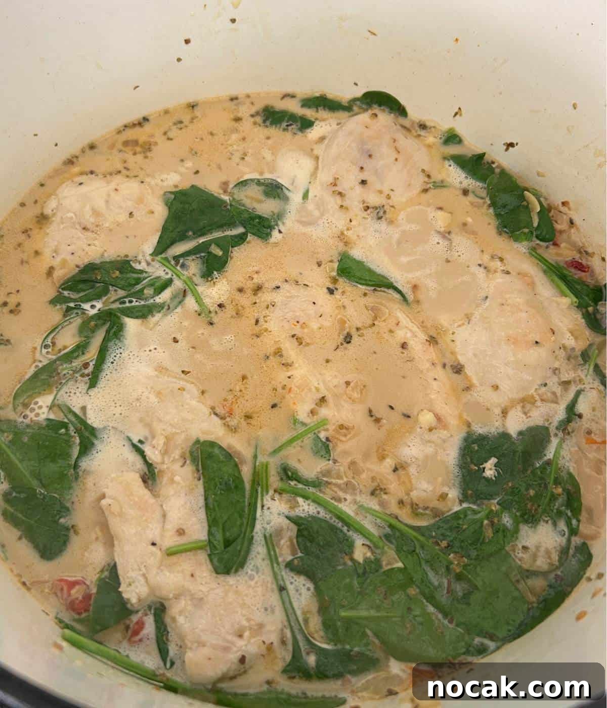 Creamy One-Pot Chicken and Orzo Bake: Comforting Weeknight Meal 10 Chicken breast nestled in pot.
